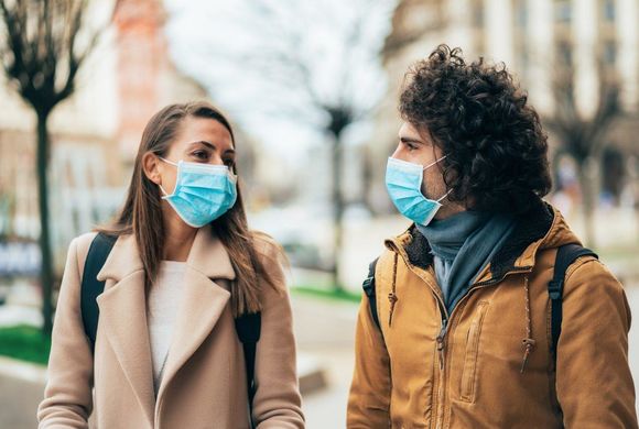 young couple wearing masks
