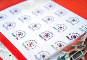 a sheet of stickers with the word RapidVax printed on them