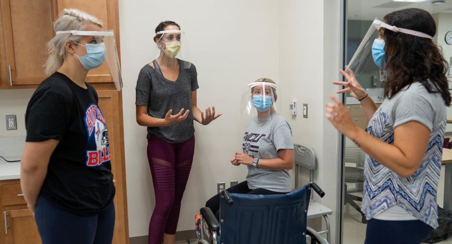 students use safe practices and social distancing during occupational therapy class