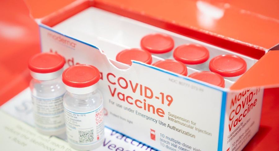box of vials filled with covid-19 vaccine
