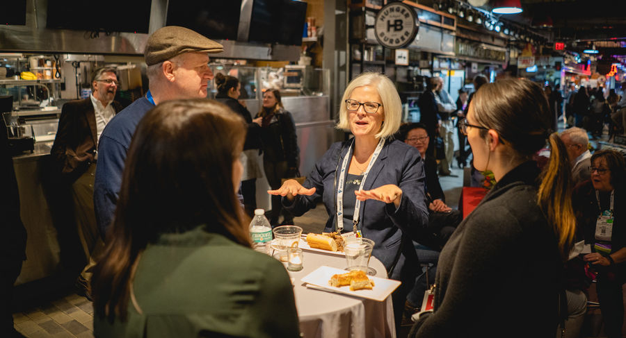 people mingle at welcome reception