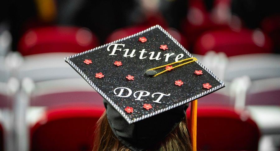 A student's graduation cap reads 'Future DPT'.