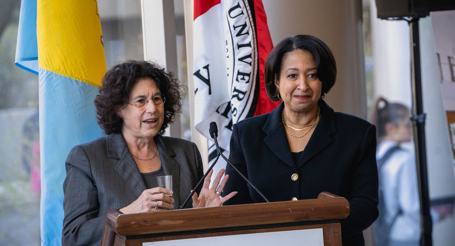 Former dean Laura Siminoff and Board of Visitors Chair Veronica Hill Milbourne lead a toast