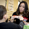 A speech pathologist works through exercises with a child