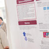 A student displays a poster