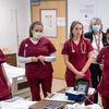 A preceptor works with nursing students