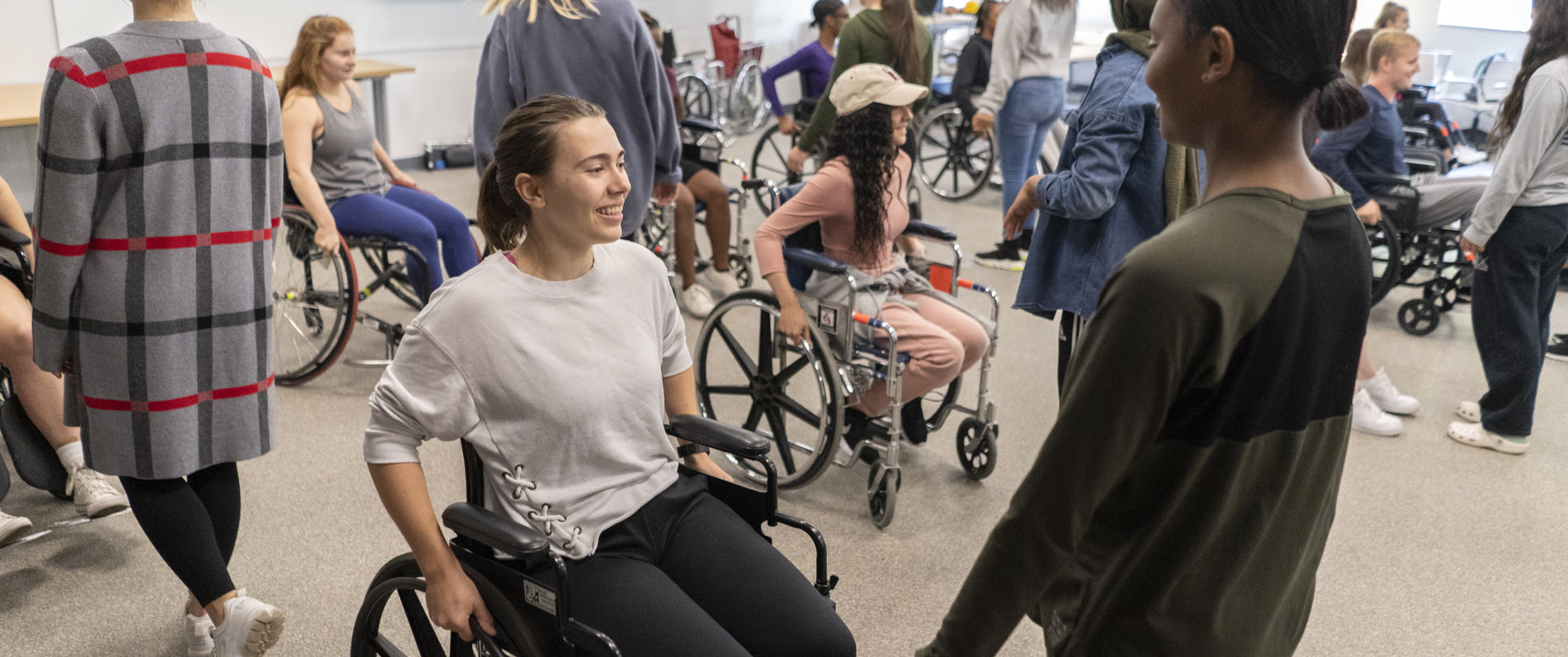 Students using wheelchairs in a recreational therapy class