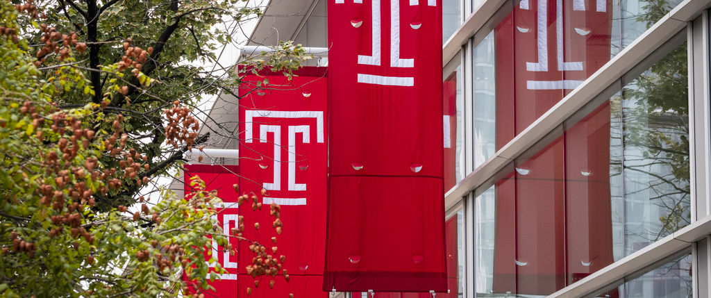 Temple flags hanging on the side of the SERC building