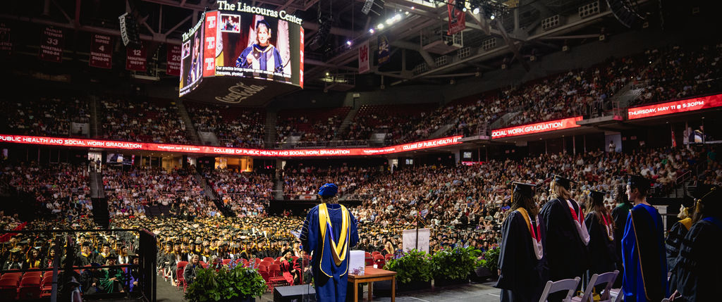 interim dean jennifer ibrahim stands on the stage in the liacouras center facing graduating students in the Class of 2023. 