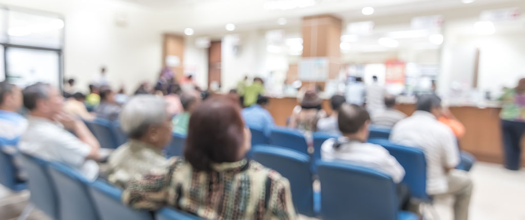 a blurred hospital waiting room