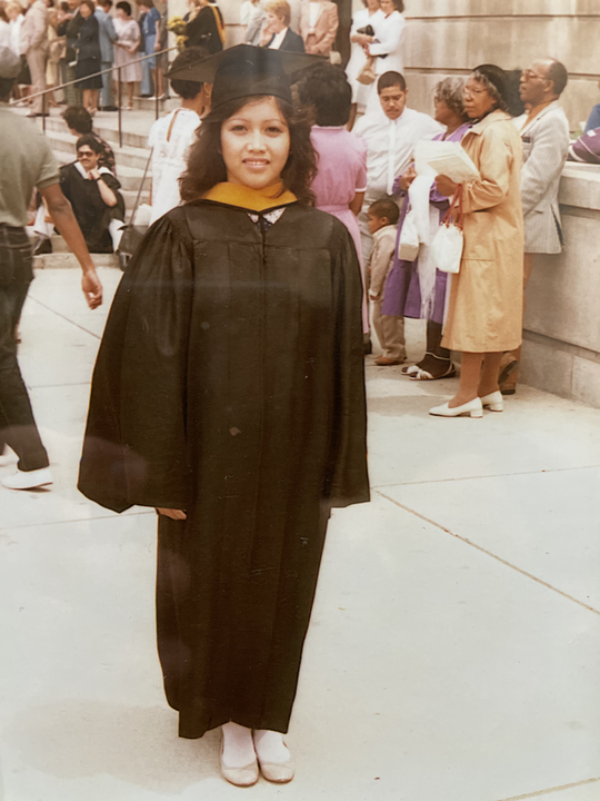 Martha Grace Armonio-Tan in cap and gown at her college graduation.