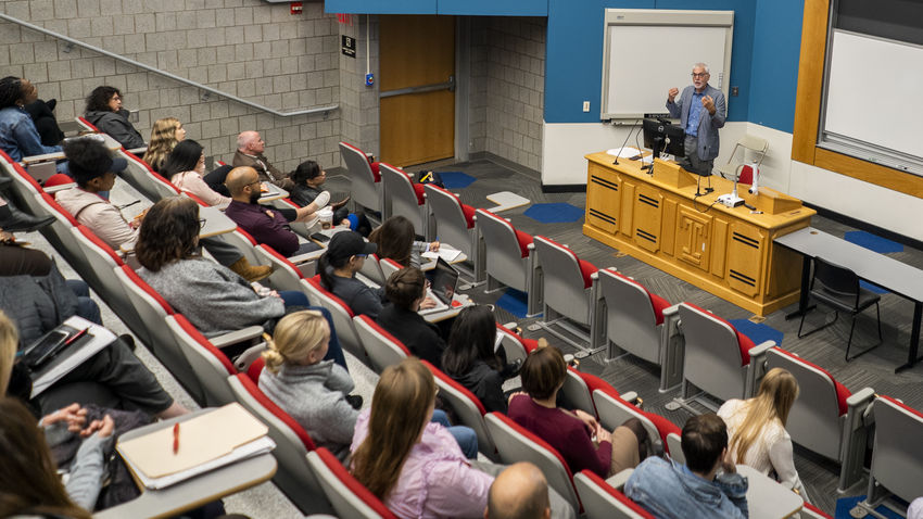 Nick Freudenberg delivering a lecture