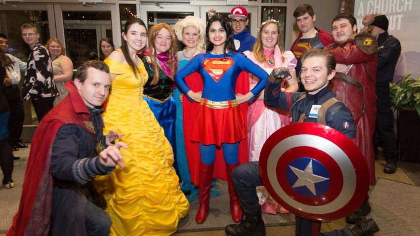 students visiting hospital or school as superheroes