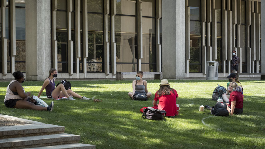 students on campus wearing masks