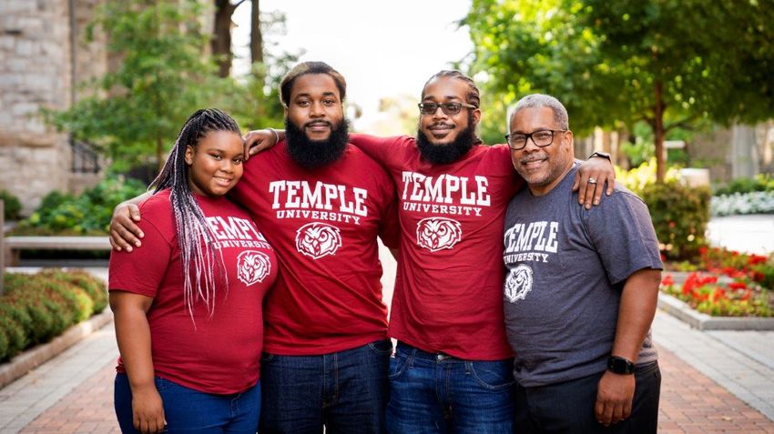 Lovell Harmon and his children on the temple campus