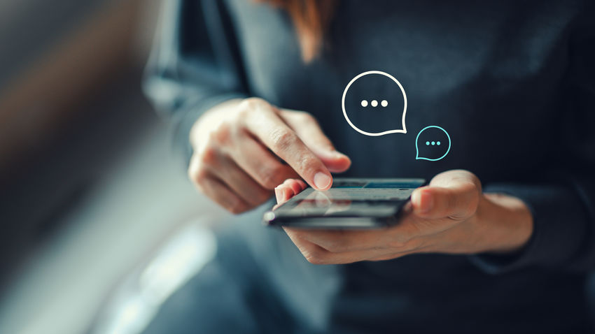 a person's hands using a mobile app on a cell phone