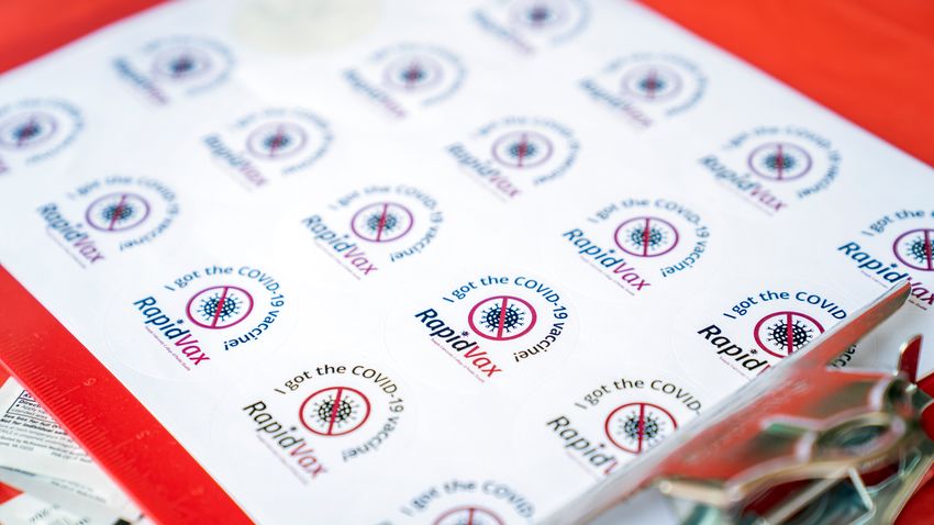 a sheet of stickers with the word RapidVax printed on them