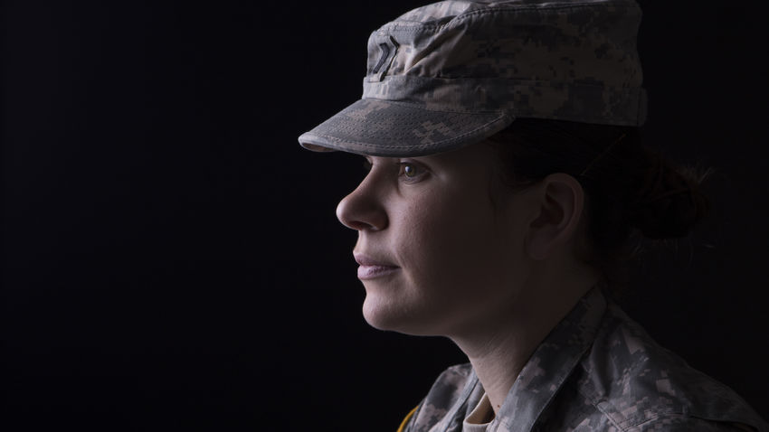 a closeup of a woman in the military