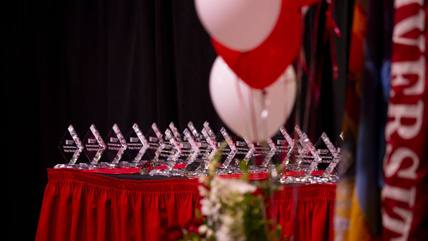 a table set up with small trophies recognizing Temples Diamond Award Recipients