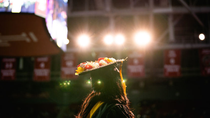 a student stands in front of the crowd at the liacouras center