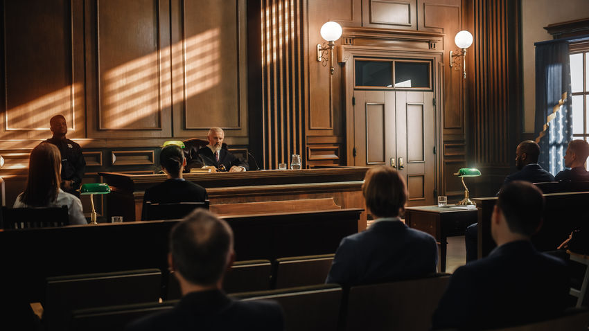 a courtroom with a judge overseeing a case