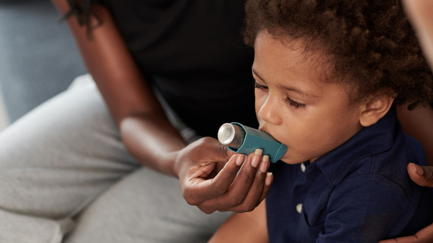 a child using an inhaler