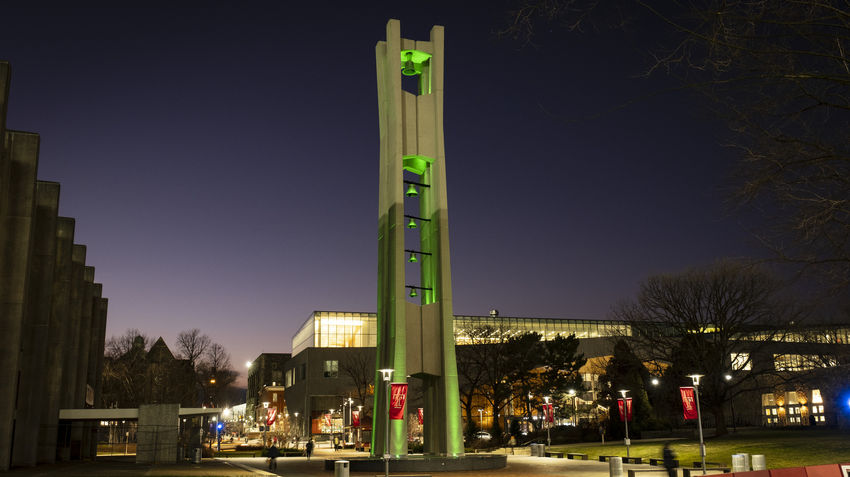 temple belltower lit with green lights