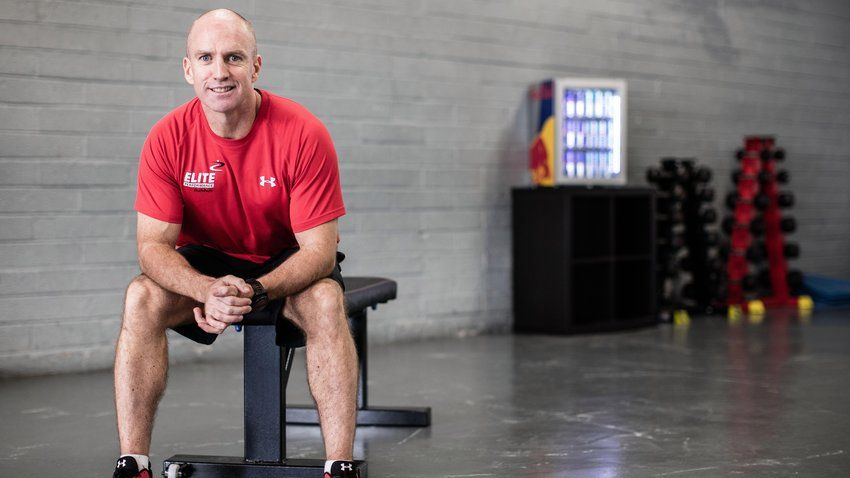 mike mcgurn sits in a fitness studio