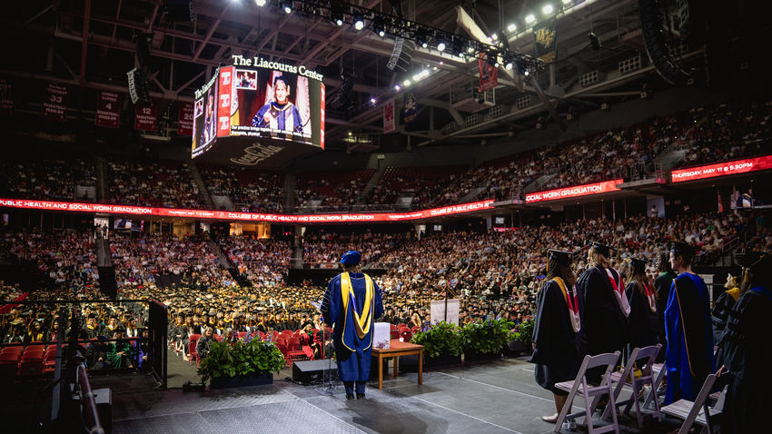 interim dean jennifer ibrahim stands on the stage in the liacouras center facing graduating students in the Class of 2023. 
