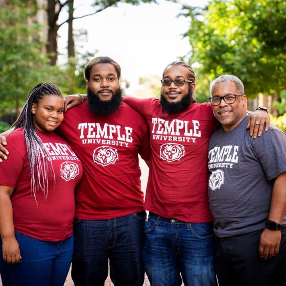 Lovell Harmon and his children on the temple campus