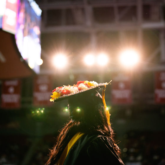 a student stands in front of the crowd at the liacouras center