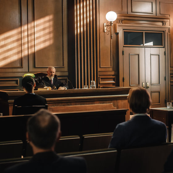 a courtroom with a judge overseeing a case